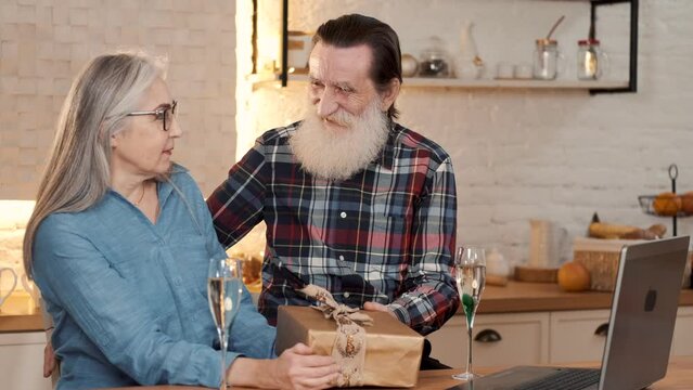 couples eating and enjoying new year together with gifts drinks