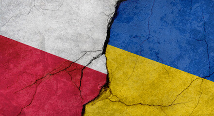 Flags of Poland and Ukraine, texture of concrete wall with cracks, orange background, military conflict concept