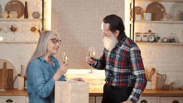 couples eating and enjoying new year together with gifts drinks