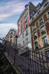Paris, romantic staircase in Montmartre, typical buildings and floor lamp

