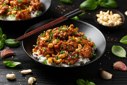 Crispy cashew Chicken stir fry with rice. Asian take away food
