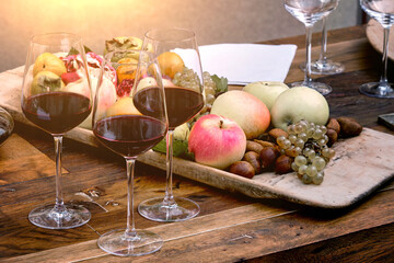 Beautiful still life with fruit and red wine.