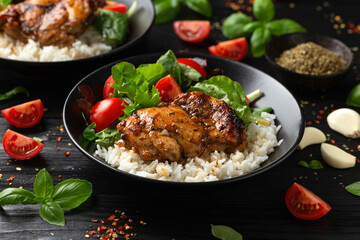 Baked balsamic chicken thighs with rice and vegetables