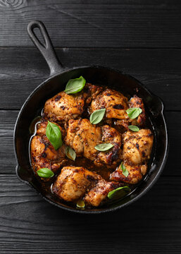 Baked balsamic chicken thighs in cast iron pan