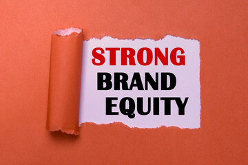 Strong Brand Equity Symbol on Torn Red Paper. Business Marketing and Branding Symbol. Red Background with Copy Space for Brand Equity Ideas.