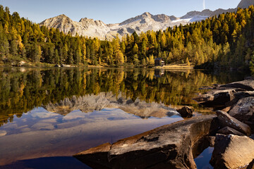 Picturesque autumn landscape on Reed See lake with mirror reflection, Austria
