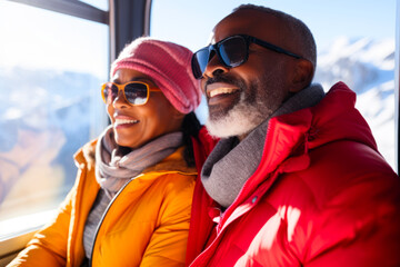Joyful couple enjoying snowy mountain cable car ride.