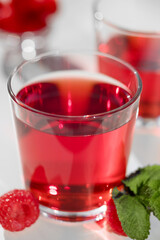 raspberry juice in a glass with mint