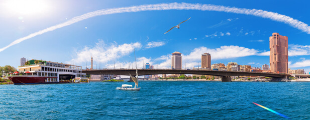 Fototapeta premium Great panorama of the Nile with modern bridge and buildings in the business district of Cairo, Egypt