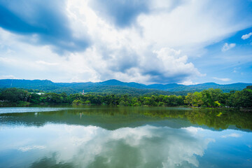 Fototapeta na wymiar a public place leisure travel landscape lake views at Ang Kaew Chiang Mai University and Doi Suthep nature forest Mountain views spring cloudy sky background with white cloud.