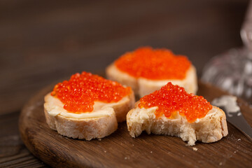 Baguette sandwiches with butter and red caviar