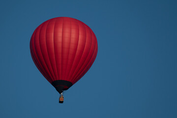 Red hot air balloon in the sky