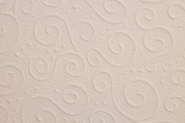 Scrapbook beige paper blank with waves pattern. Texture relief copy space wallpaper background.