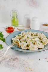 Russian homemade meat dumplings pelmeni.