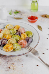 Russian homemade meat dumplings colorful pelmeni.