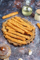 Italian grissini or salted bread sticks with sesame seeds.