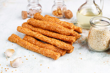 Italian grissini or salted bread sticks with sesame seeds.