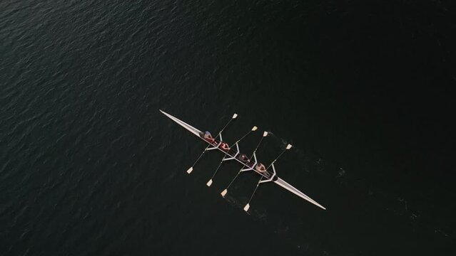 Top View of a Sport Canoe Being Driven by a Team of Young Women in Ocean 