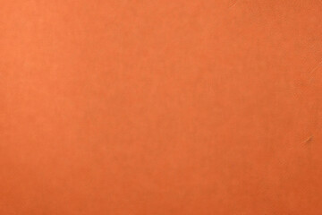 Fototapeta premium A tight shot unveils the intricate texture of vibrant orange leather