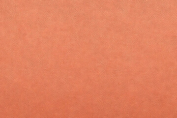 Fototapeta premium A close-up tactile allure of orange leather texture