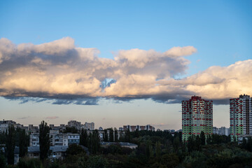 Beautiful clouds over the city. Cloudy sky over the city.