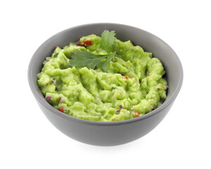 Bowl of delicious guacamole with parsley isolated on white