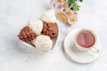 Delicious homemade meringue cookies with coconut flakes.