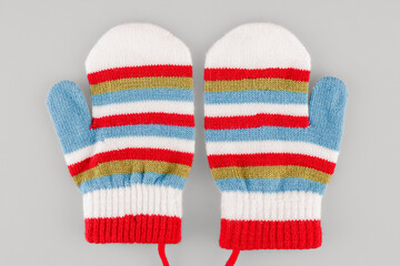 Wool fabric mittens for cold winter weather, warm hands in children, children's clothing, isolated on a white background