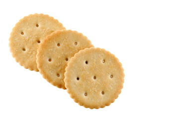Healthy whole wheat cracker on white background. Stack of Saltine crackers isolated on white background. Round crackers.