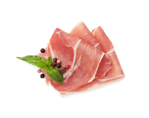 Slices of delicious jamon, spices and basil isolated on white, top view