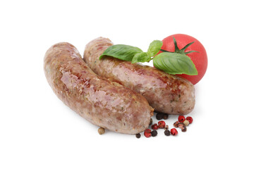 Tasty homemade sausages, peppercorns, tomato and basil leaves isolated on white