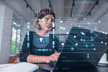 Pensive attractive beautiful businesswoman in formal wear working on laptop at office workplace in background. Concept of data protection information technology. lock icon hologram. - obrazy, fototapety, plakaty