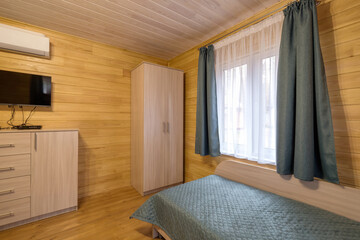 interior of wooden eco bedroom in studio apartments,  hostel or homestead
