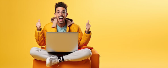 Joyful surprised man sitting with laptop on his lap in winning pose isolated on flat pastel background with copy space. Online giveaway banner template. 