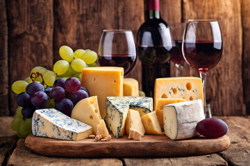 Wine, cheeses and grapes in a vintage setup. Generative Ai.