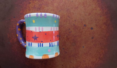 colorful  hand painted pottery mug with abstract design 