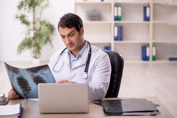 Young male doctor radiologist working in the clinic