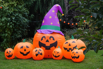 inflatable Halloween decorations on front lawn of house