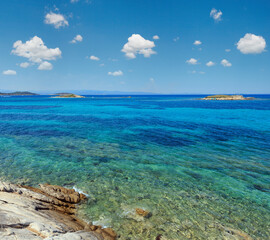Fototapeta na wymiar Aegean sea coast landscape with rocky island, view near Karidi beach (Chalkidiki, Greece).