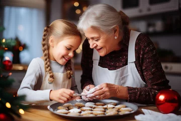 Foto op Aluminium Caucasian grandmother baking cookies at Christmas with granddaughter. Festive baking © ink drop