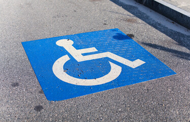 wheelchair accessibility sign against a modern cityscape, conveying equality and mobility for all