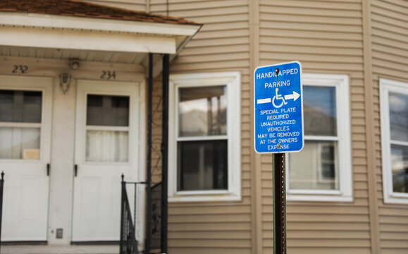 wheelchair accessibility sign against a modern cityscape, conveying equality and mobility for all