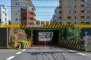 Road tunnel going below railway, with height limit, Tokyo, Japan