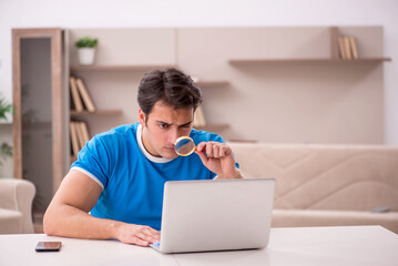 Young man freelancer working from home