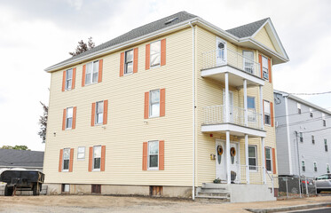 suburban townhomes, symbolizing real estate inflation and rising housing costs in a market vulnerable to crashes