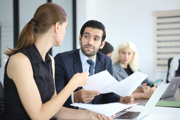 Business People, Successful business professionals. Diverse team celebrating business success at meeting.