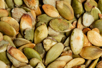 Macro photography of shelled pumpkin seed.