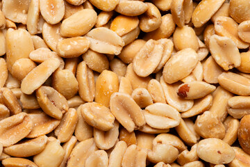 Macro photography of shelled and roasted peanuts.