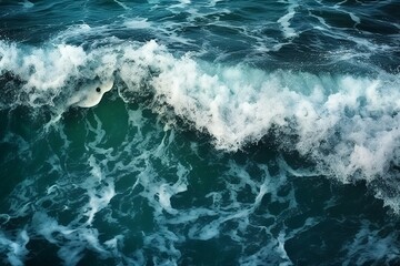 Fototapeta premium Sea wave with foam, top view. Blue ocean wave background. Close up view of ocean water surface. Sea wave texture
