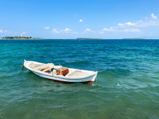 Naklejka premium Small fishing boat in the cost of Aegean sea in Urla, Izmir, Turkey